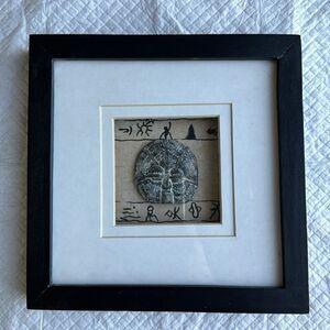 Southwestern or tribal mask medallion wall decor brown and black frame